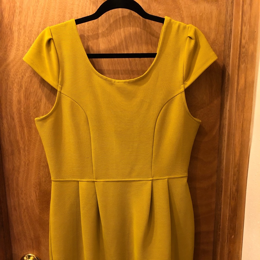 Mustard colored dress.
